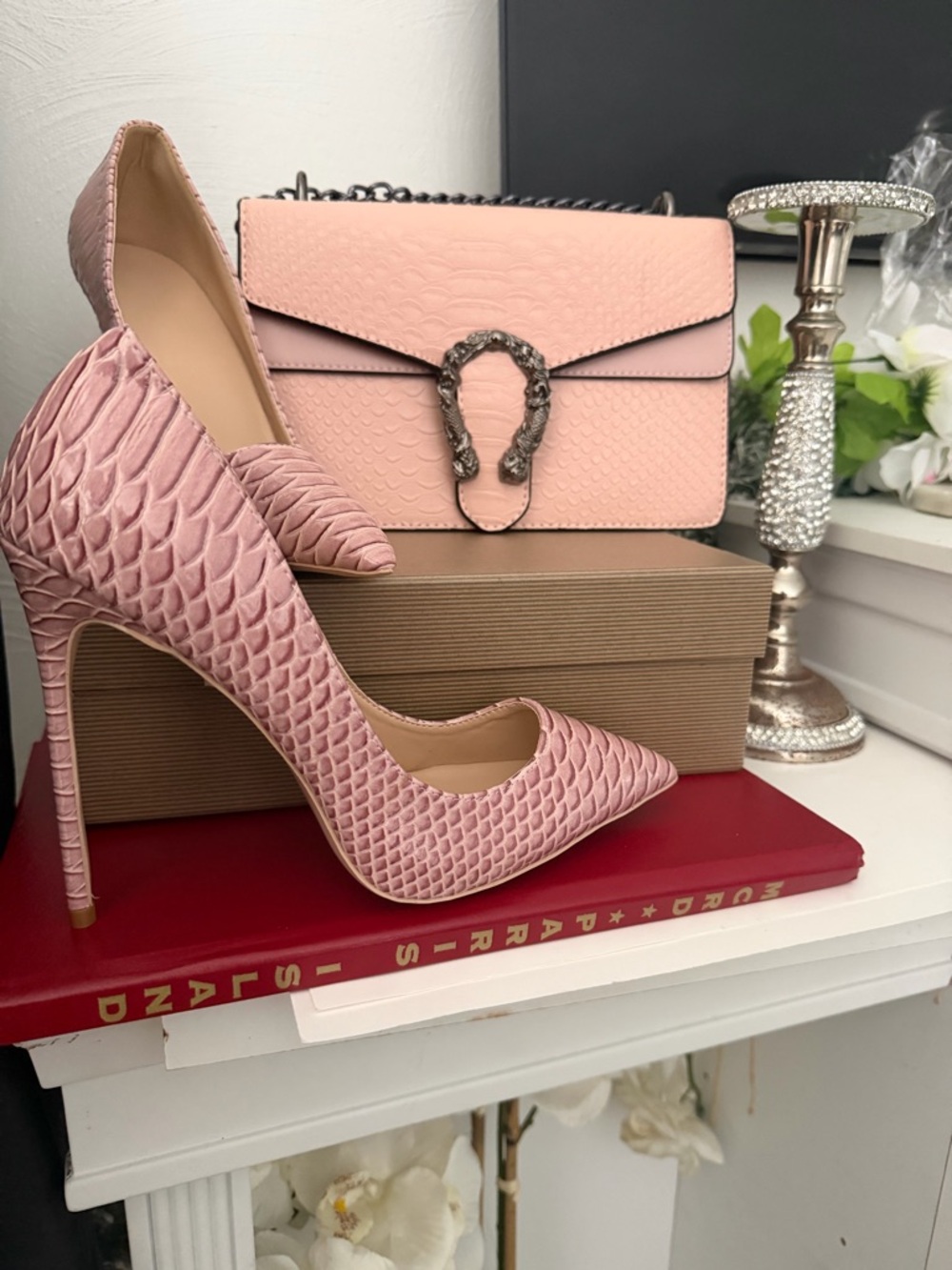 Matching light pink snake print heels and handbag